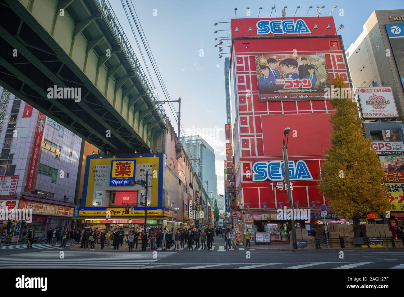 View Of The Chuo Dori Avenue Street With People Underneath The Jr Bridge Close Waiting To