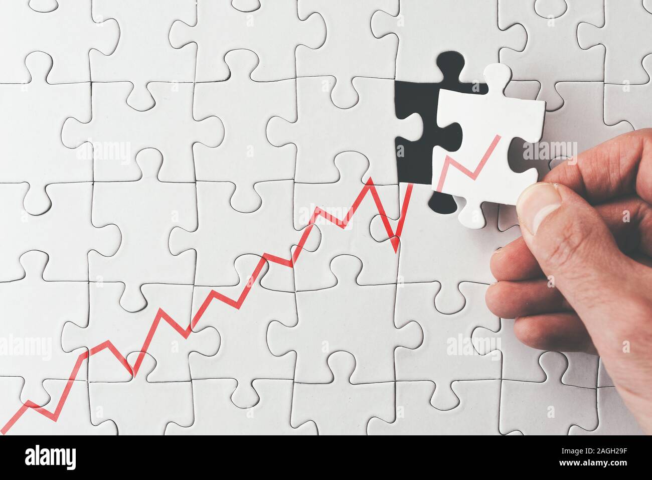 top view of growing graph on jigsaw puzzle, business success and economic growth concept Stock Photo