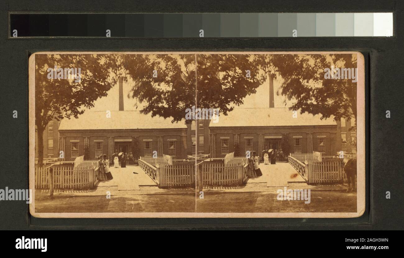 Ladies standing at the front of a building published by Conant Bros