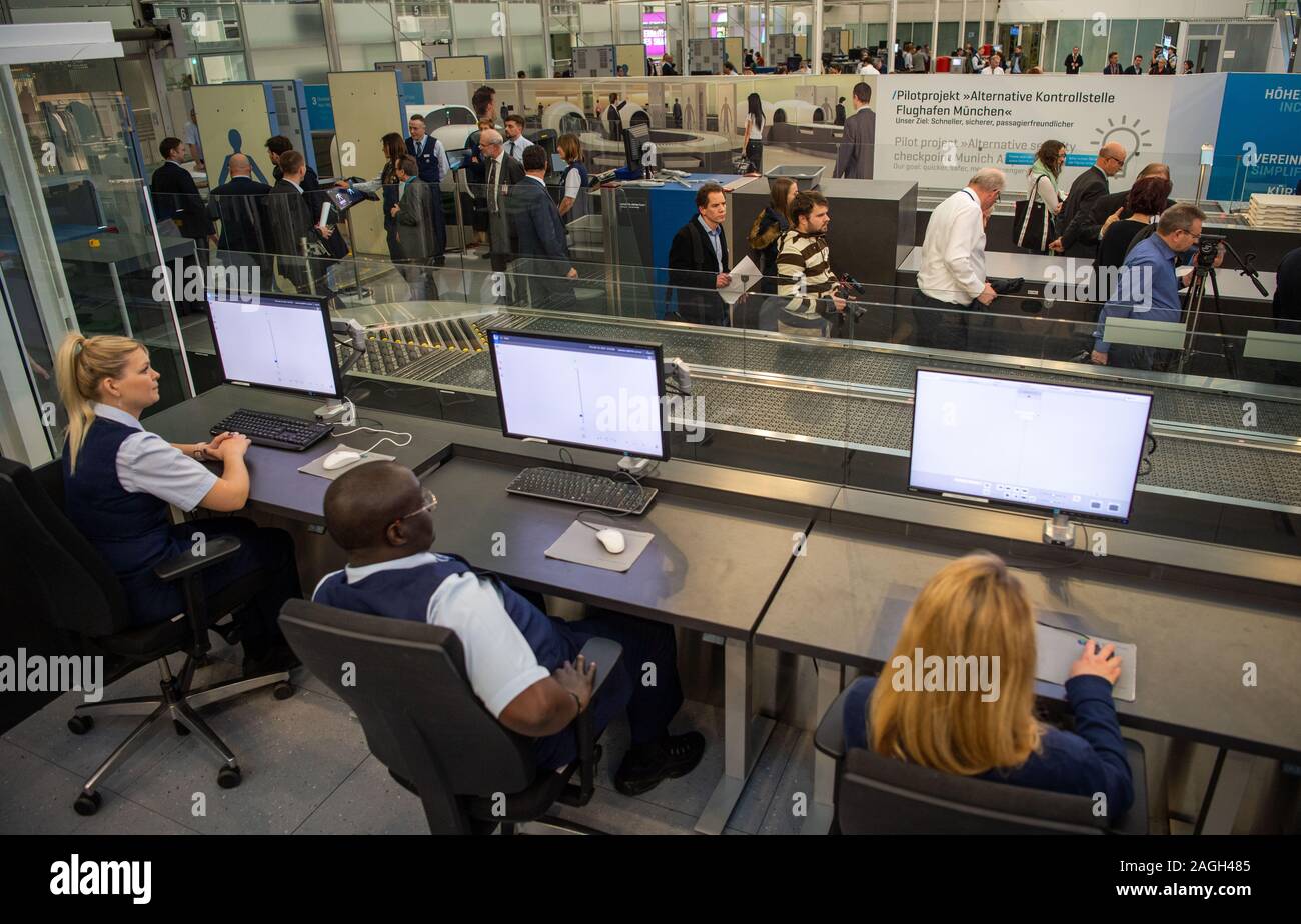 Munich, Germany. 19th Dec, 2019. Airport employees sit at monitors at the security checkpoint at Munich Airport. In a press conference, Transport Minister Reichhart (CSU) announced the first test results of the newly installed safety system. Credit: Lino Mirgeler/dpa/Alamy Live News Stock Photo