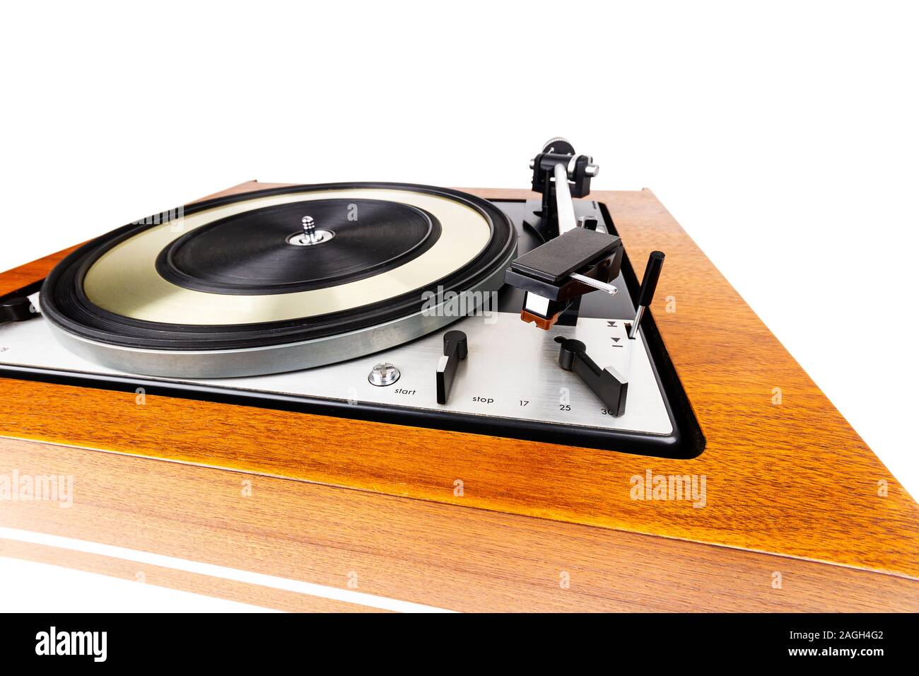 Vintage turntable vinyl record player isolated on white. Wooden plinth ...