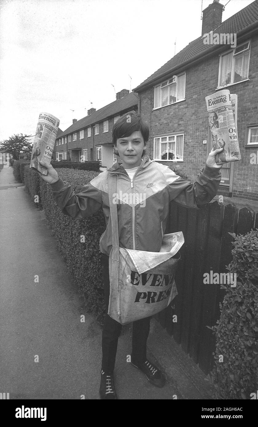 1980s, historical, teenage newspaper boy delivering a local evening paper, Yorkshire, England, UK. Stock Photo