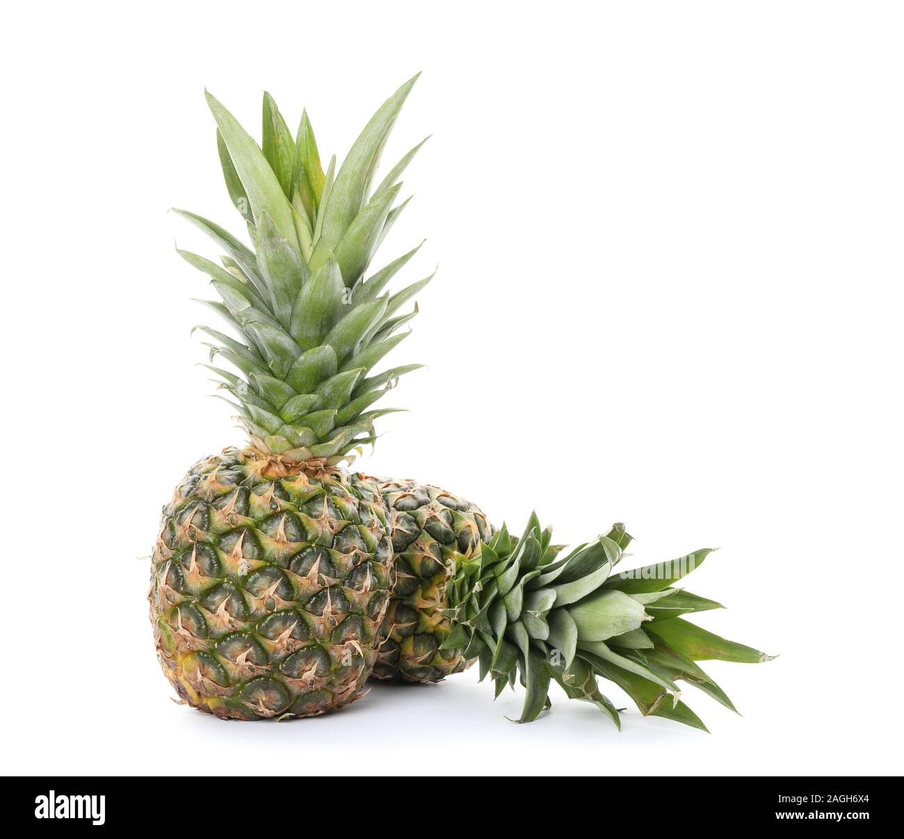 Pineapples isolated on white background. Juicy fruit Stock Photo