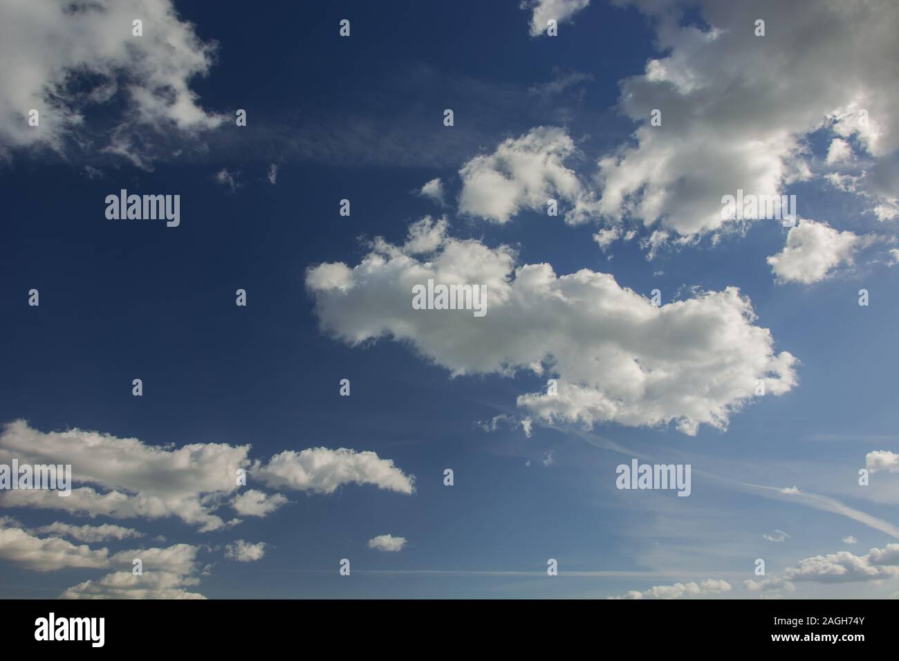 White-gray clouds on blue sky - background Stock Photo - Alamy