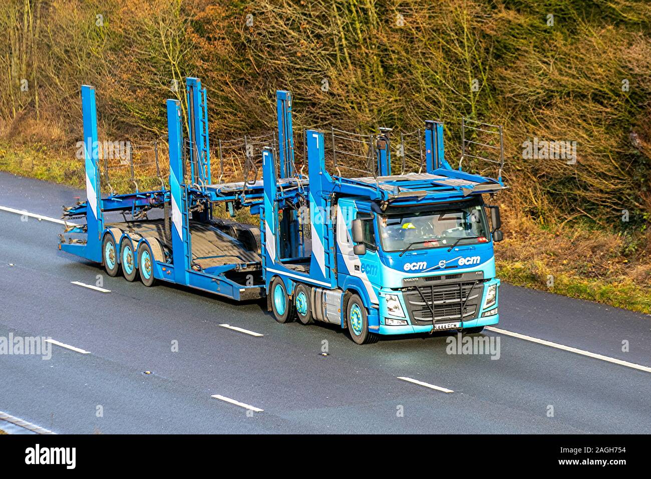 ECM Vehicle Delivery Service Ltd. Empty car carrier, Haulage delivery trucks, lorry, transportation, truck, carrier, Volvo vehicle, European commercial transport, industry, M61 at Manchester, UK Stock Photo