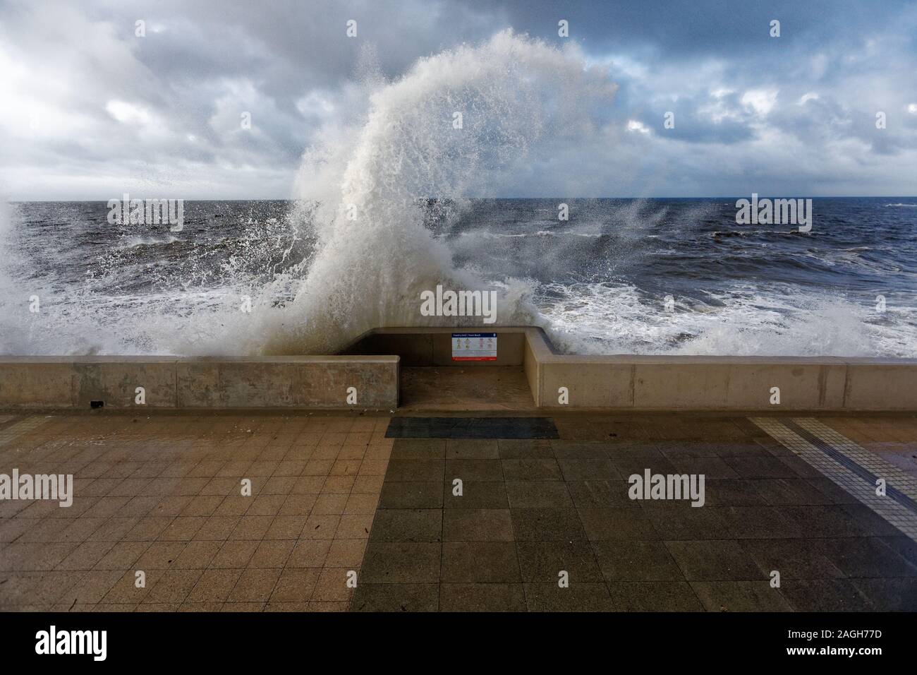 Pictured: Waves crash against the promenade wall in Porthcawl, Wales, UK. Tuesday 01 October 2019 Re: Heavy rain and strong winds caused by Hurricane Stock Photo