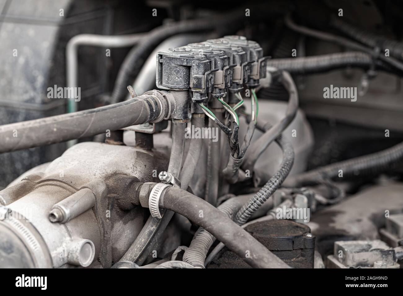 Gas fuel system parts of a SUV hybrid car, gas nozzles closeup photo with selective soft focus