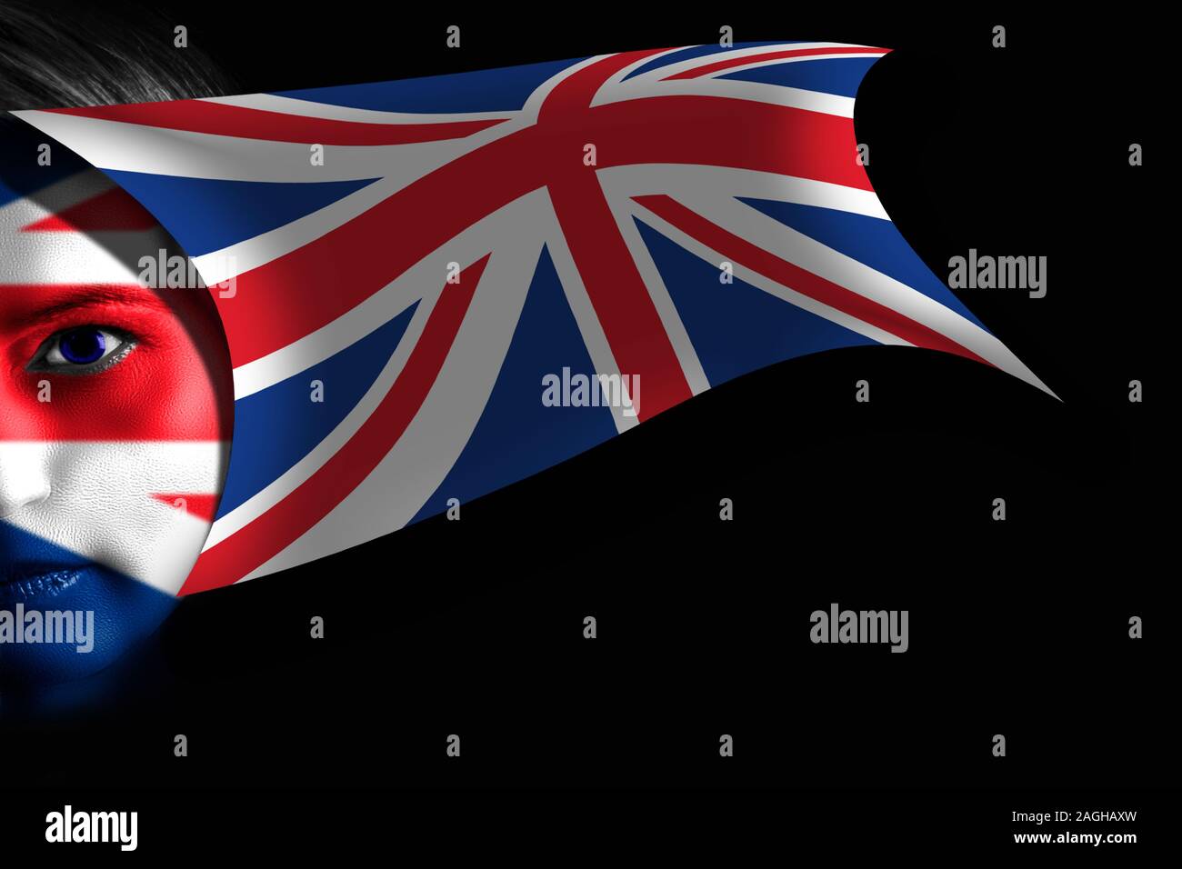 United Kingdom flag painted on human face and waving on black background. Stock Photo