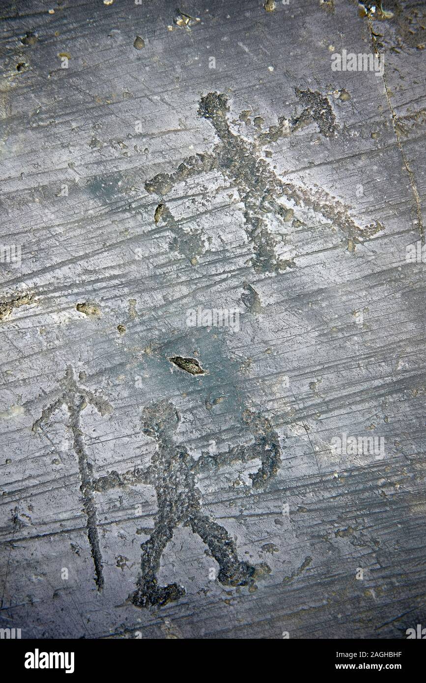 Prehistoric Petroglyph, rock carving, of what is known as a praying man carved by the Camunni people in the iron age between 1000-1600 BC, Seradina I Stock Photo