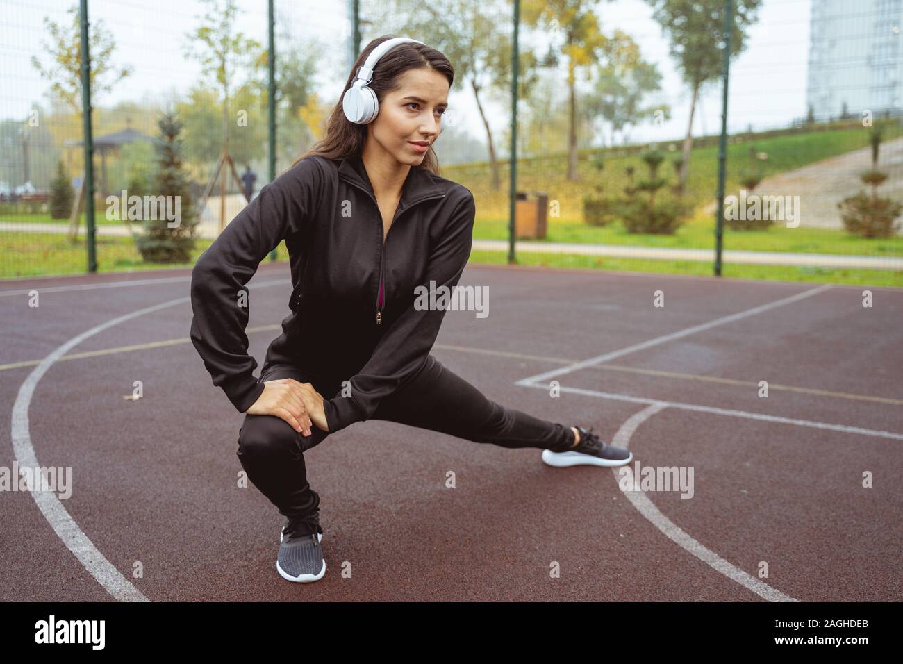 Concentrated longhaired brunette doing active work out Stock Photo