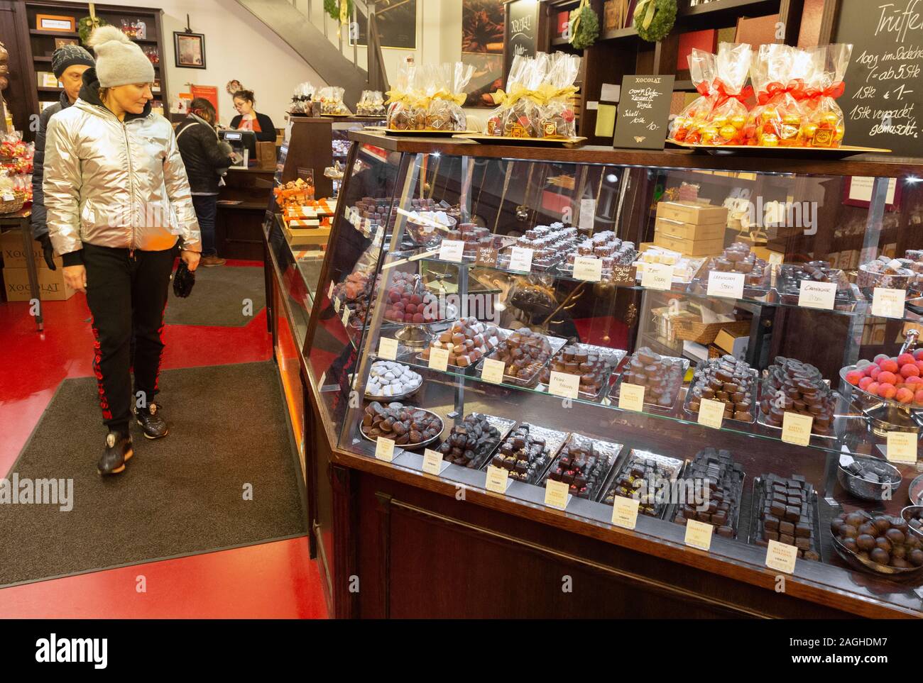Vienna chocolate shop; a woman shopping for chocolates in a