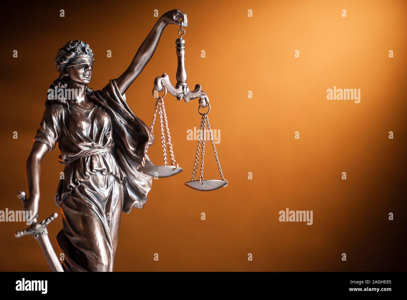 Bronze statue of Justice holding up scales Stock Photo