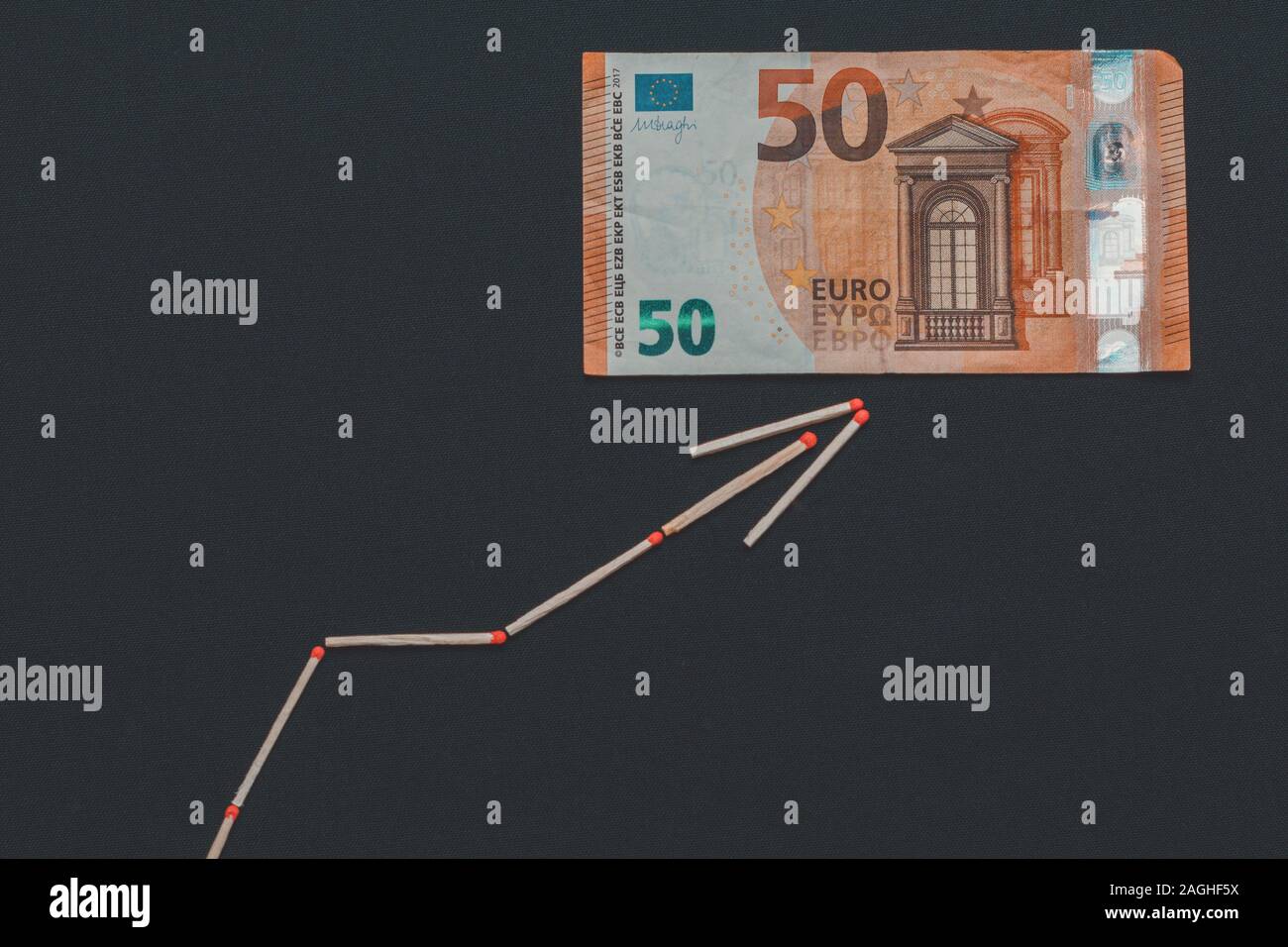 Euro rise and fall graph, banknote on black background Stock Photo Alamy