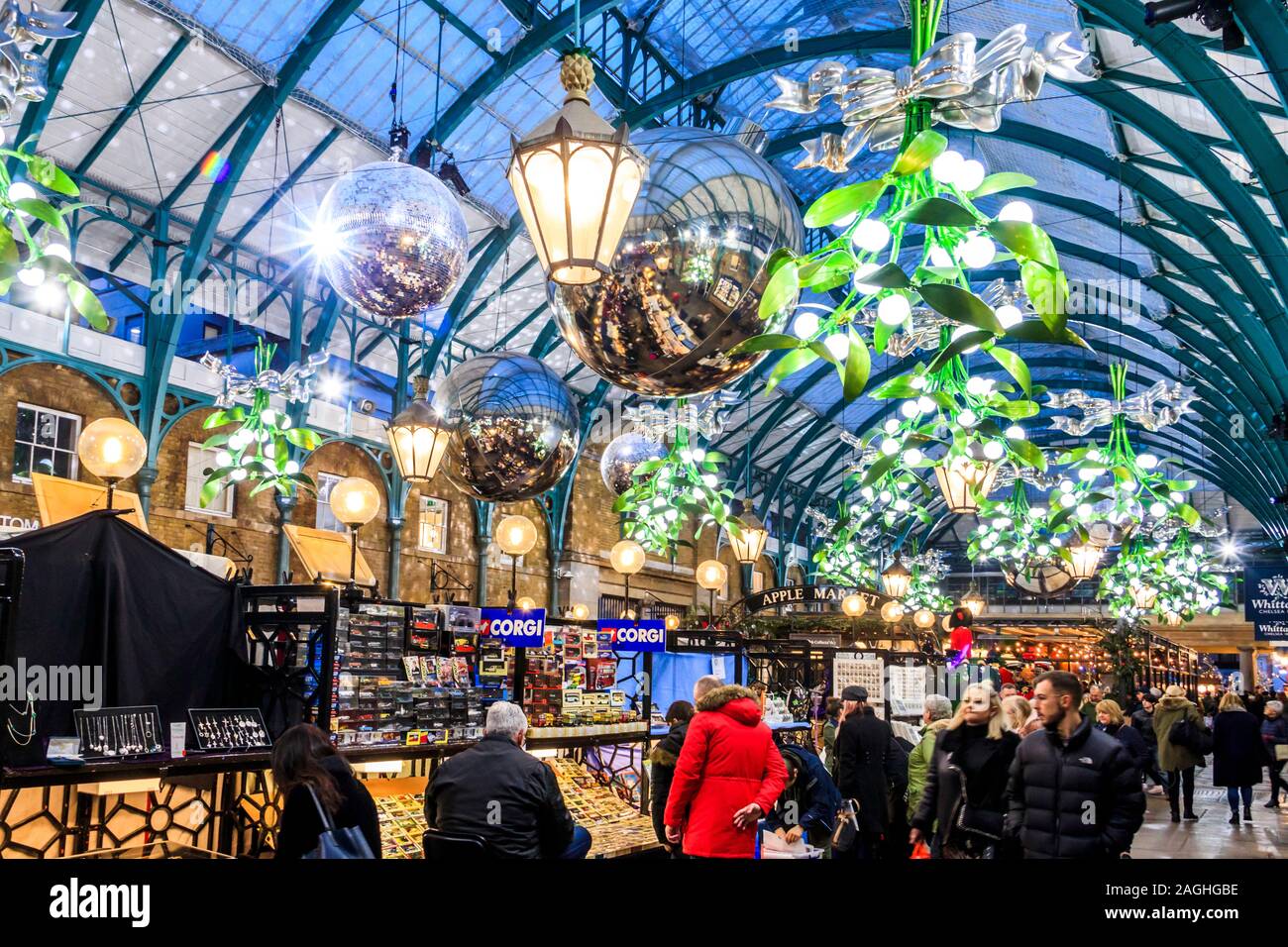 Shoppers and tourists in the indoor Apple Market at Covent Garden, London, UK Stock Photo