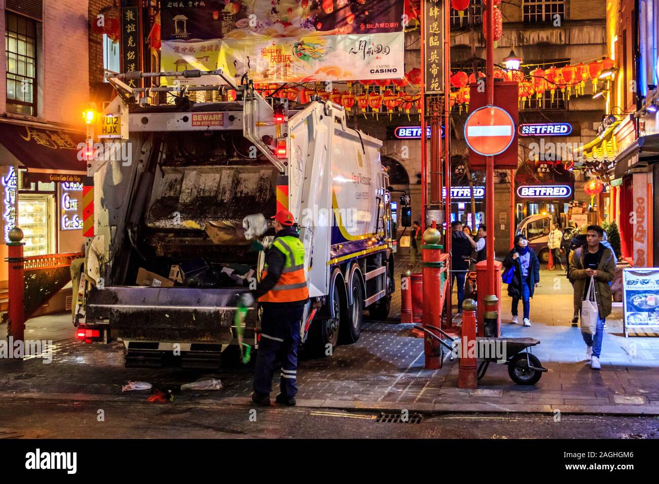 Night time refuse collection in Chinatown, Soho, London, UK Stock Photo