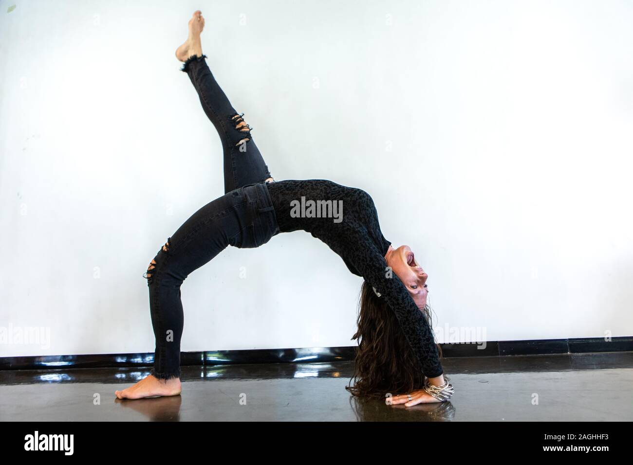 Longest time to hold two yoga poses (wheel pose, bow pose) - World Records  Union™