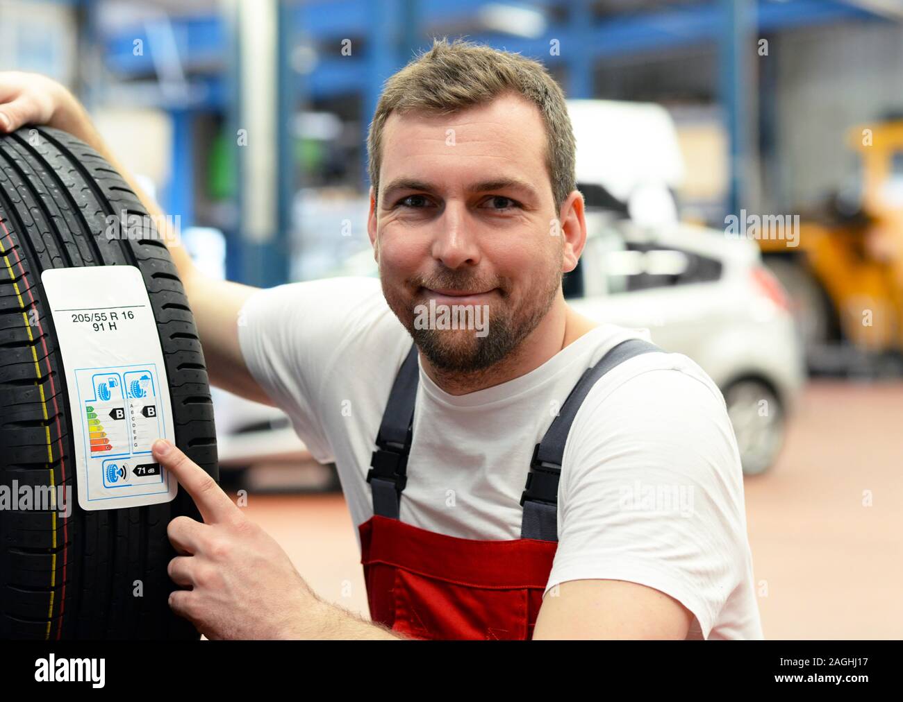 Economy Sticker With Consumption Values On A New Car Tyre Changing Tyres In The Workshop By