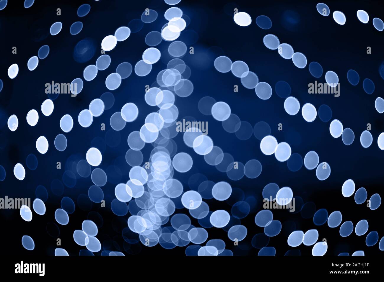Trendy color of the year 2020. Photo of blue bokeh lights on black background. Perfect for overlay. Stock Photo