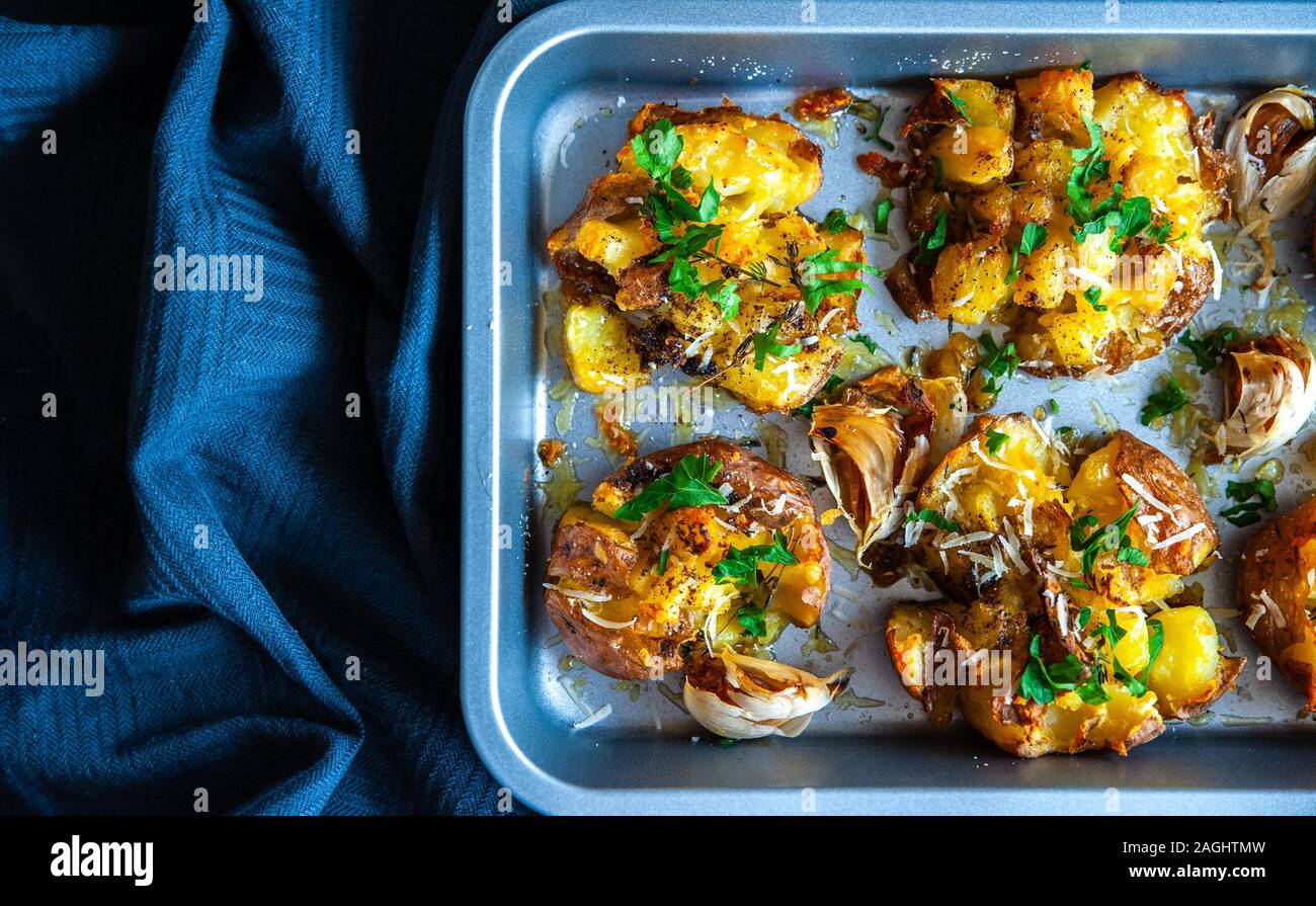 Top view of the roasted and baked potatoes in oven tray Stock Photo