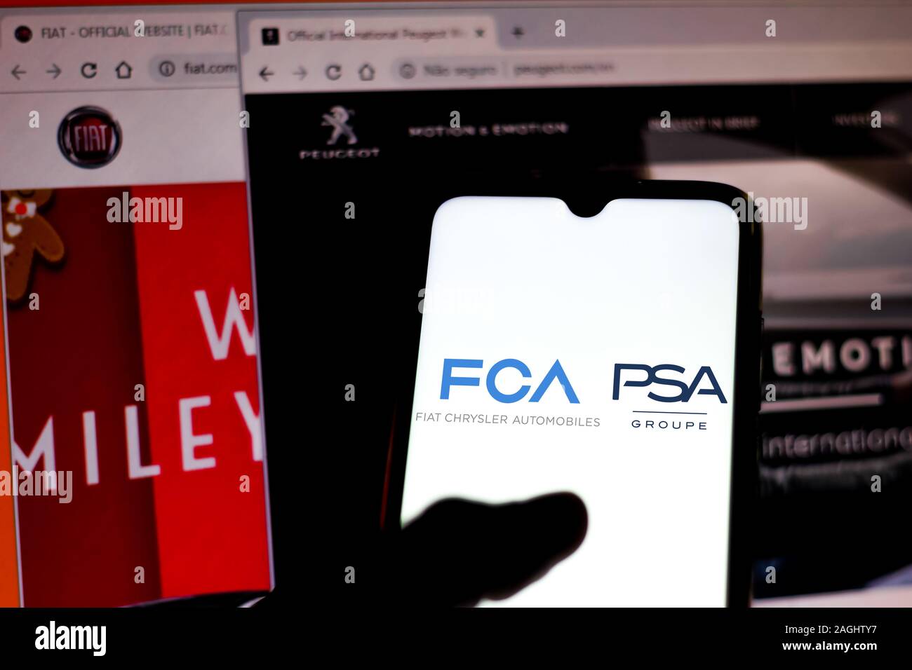 Brazil. 19th Dec, 2019. In this photo illustration the Fiat Chrysler Automobiles and Groupe PSA logo is seen displayed on a smartphone and open websites on a blurred background. Credit: Rafael Henrique/SOPA Images/ZUMA Wire/Alamy Live News Stock Photo