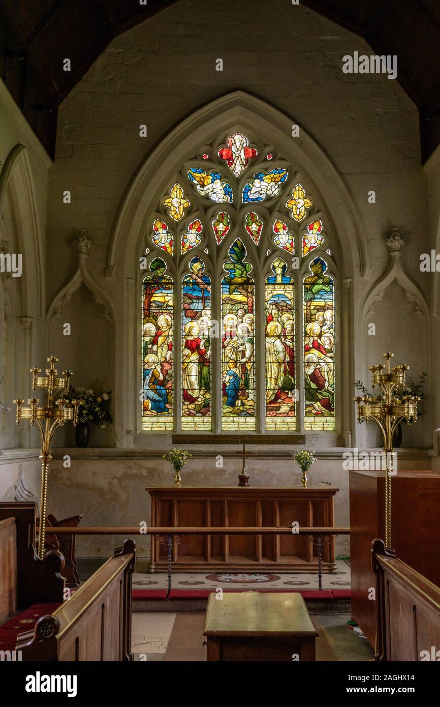 Stained glass windows inside the Church of Saint Andrew and Saint Mary in Grantchester, as featured in the tv series Grantchester. Stock Photo