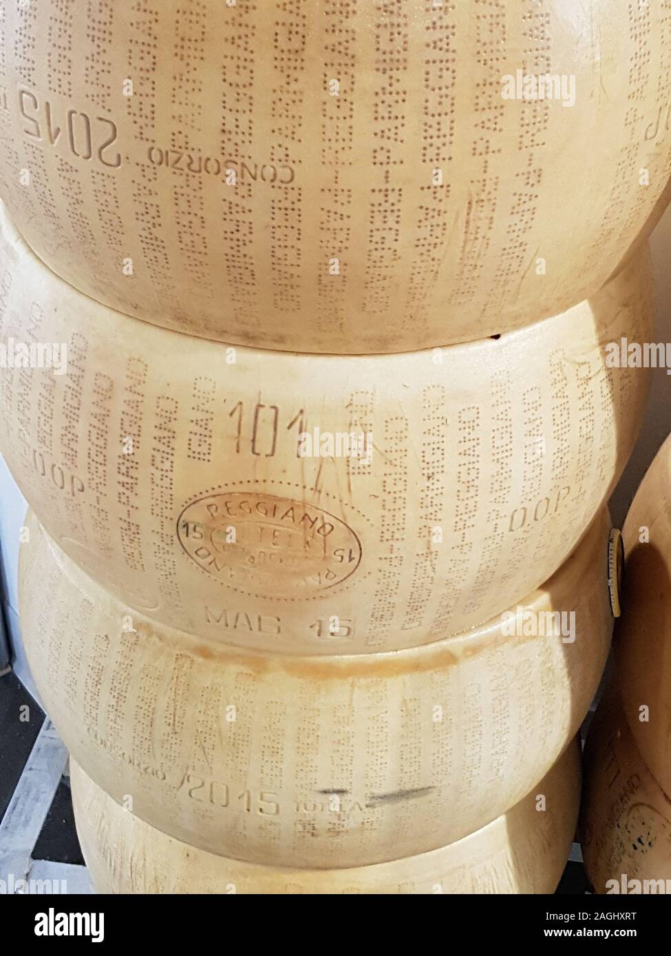USA, Boston - January 2018 - Wheels of parmegiano reggiano stacked for sale Stock Photo