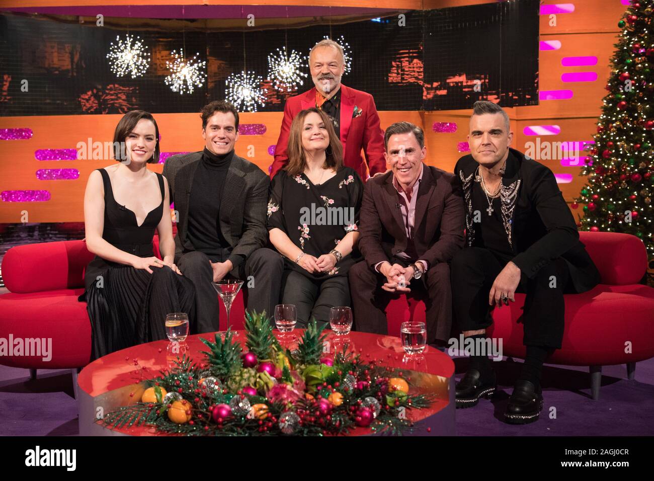 (left to right) Daisy Ridley, Henry Cavill, Ruth Jones, Rob Brydon and Robbie Williams with host Graham Norton during the filming for the Graham Norton Show at BBC Studioworks 6 Television Centre, Wood Lane, London, to be aired on BBC One on Friday evening. Picture date: Thursday December 19, 2019. Photo credit should read: PA Images on behalf of So TV Stock Photo