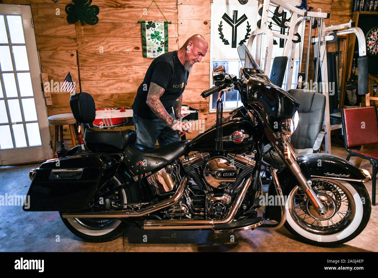 Dahlonega, Georgia, USA. 16th Sep, 2019. CHESTER DOLES checks on his Harley Davidson motorcycle, which he considers part of American culture. He said that 'America means the continuing of Western civilization, a way of life, to be patriotic, to hang on to our institutions as they had been' to hang on to the idea that marriage is between a man and a woman, that life starts in conception. These things are the very fabric of western civilization, and the world as we know it, and on the horizon is a growing trend of liberalism, socialism, that will erode our institutions and destroy our very w Stock Photo