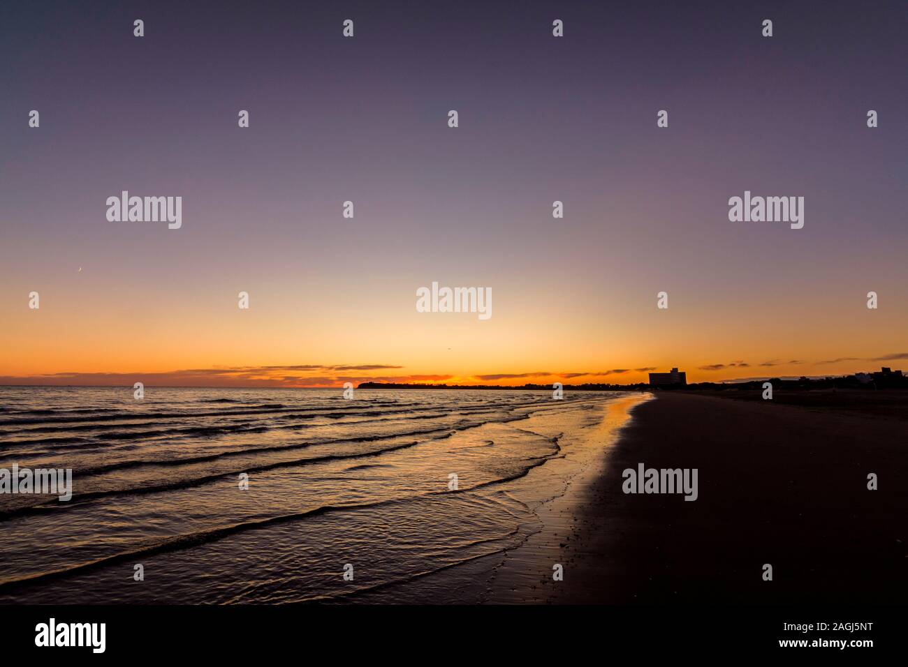 Orange sunrise on the beach in Puerto Madryn, Patagonia, Argentina Stock Photo