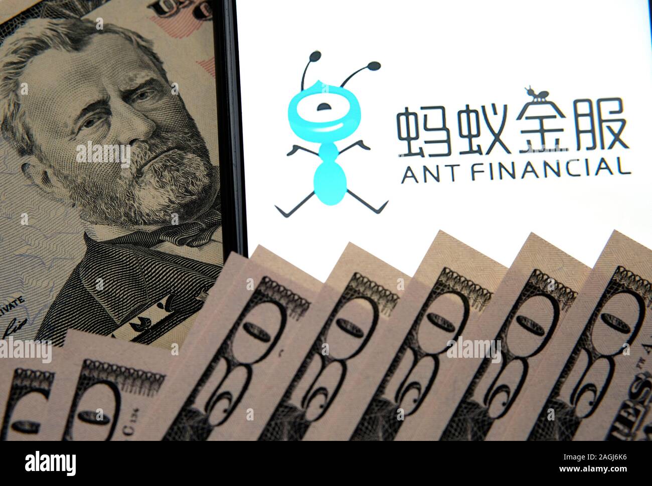 Portrait of Ulysses Grant on 50 dollar bill and Ant Financial logo on the smartphone screen. Conceptual photo. Stock Photo