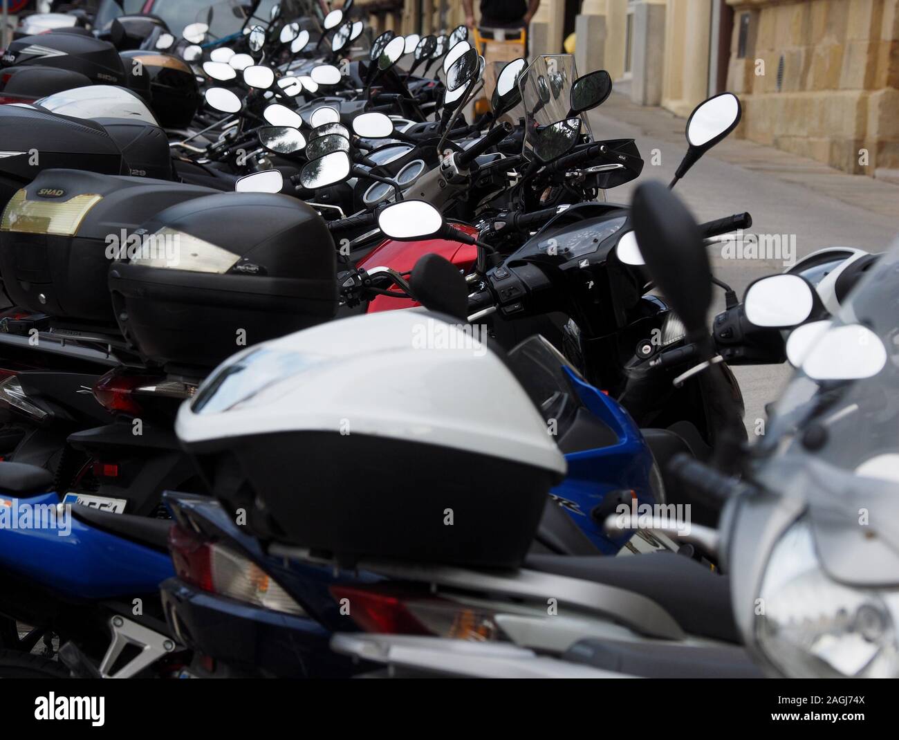 Motorcycle Many Mirrors line of many motorcycles parked with overlapping silver mirrors ...