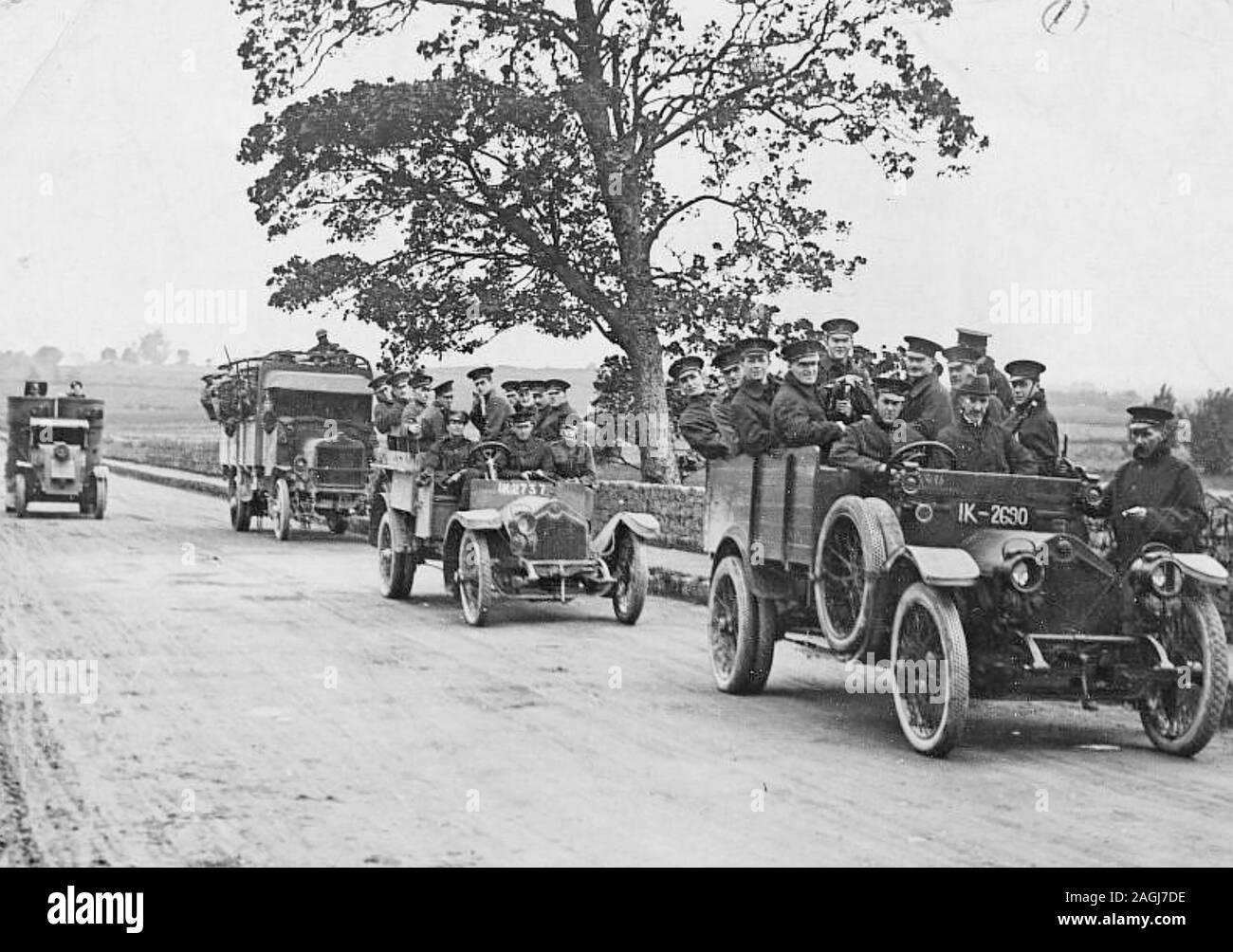 ROYAL IRISH POLICE on patrol in Limerick in 1920. Note the armoured car at left. Stock Photo
