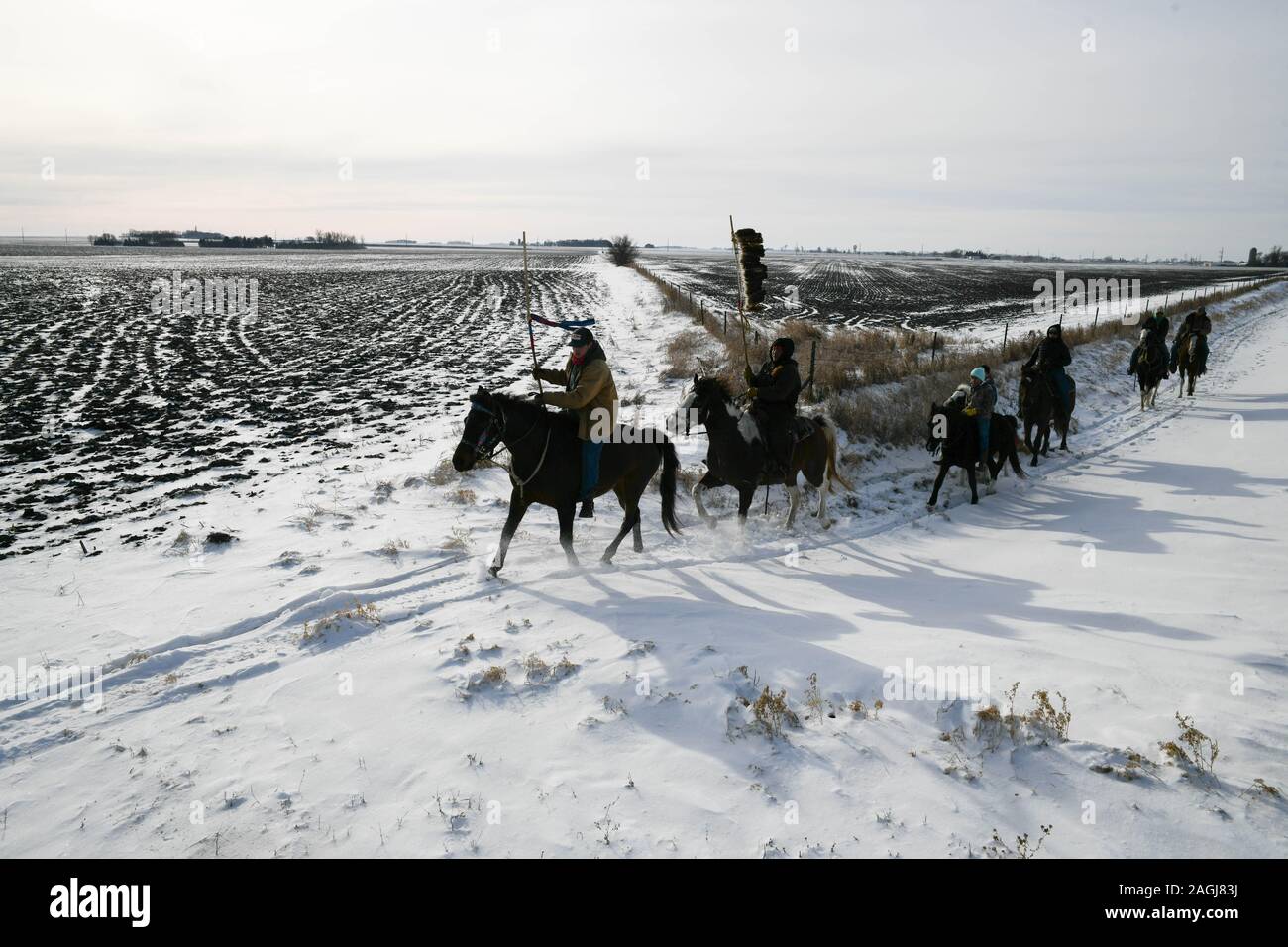 Pipestone, Minnesota, USA. 19th Dec, 2019. Riders continue their journey through Pipestone Minnesota on Thursday, the 9th day and 203 mile of a 325-mile Dakota 38 2 Memorial Ride to Mankato, Minnesota, site of the largest mass execution in U.S. history. President Abraham Lincoln ordered the hanging of 38 Dakota Indians''”and later, two chiefs''”following their uprising against the U.S. government. Credit: ZUMA Press, Inc./Alamy Live News Stock Photo