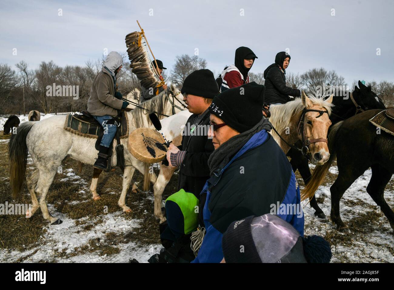Russell, Minnesota, USA. 19th Dec, 2019. Riders circle elders as they pray for them during their arrival to Russell, Minnesota on Thursday, the 9th day and 203 mile of a 325-mile Dakota 38 2 Memorial Ride to Mankato, Minnesota, site of the largest mass execution in U.S. history. President Abraham Lincoln ordered the hanging of 38 Dakota Indians''”and later, two chiefs''”following their uprising against the U.S. government. Credit: ZUMA Press, Inc./Alamy Live News Stock Photo