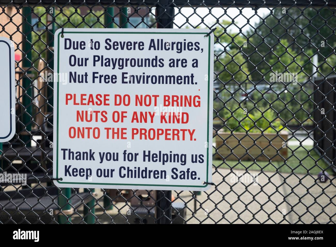 Sign saying: Due to Severe Allergies our playgrounds are a nut free environment. Please do not bring nuts of any kind onto the property. Stock Photo