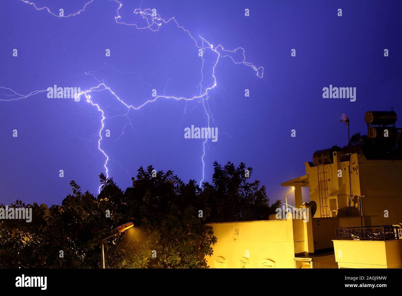 Dangerous storm of lightning and lightning in the clouds that touch the