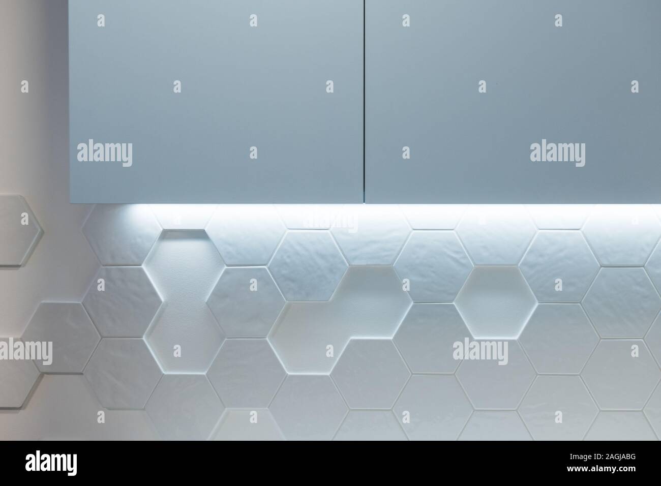 Kitchen Cabinet On Wall With Hexagon Tiles In Modern Kitchen Stock Photo Alamy
