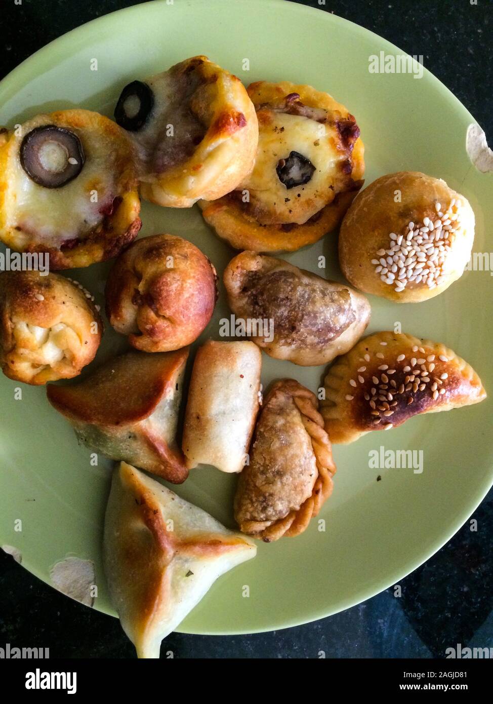 Close up still life of Lebanese pastries on a green ceramic plate. Stock Photo