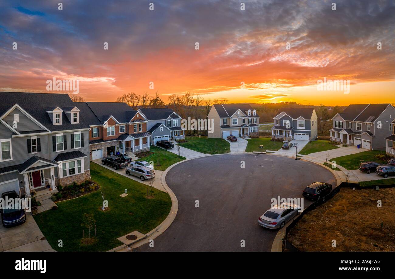 Aerial view of typical American single family house neighborhood during sunset Stock Photo