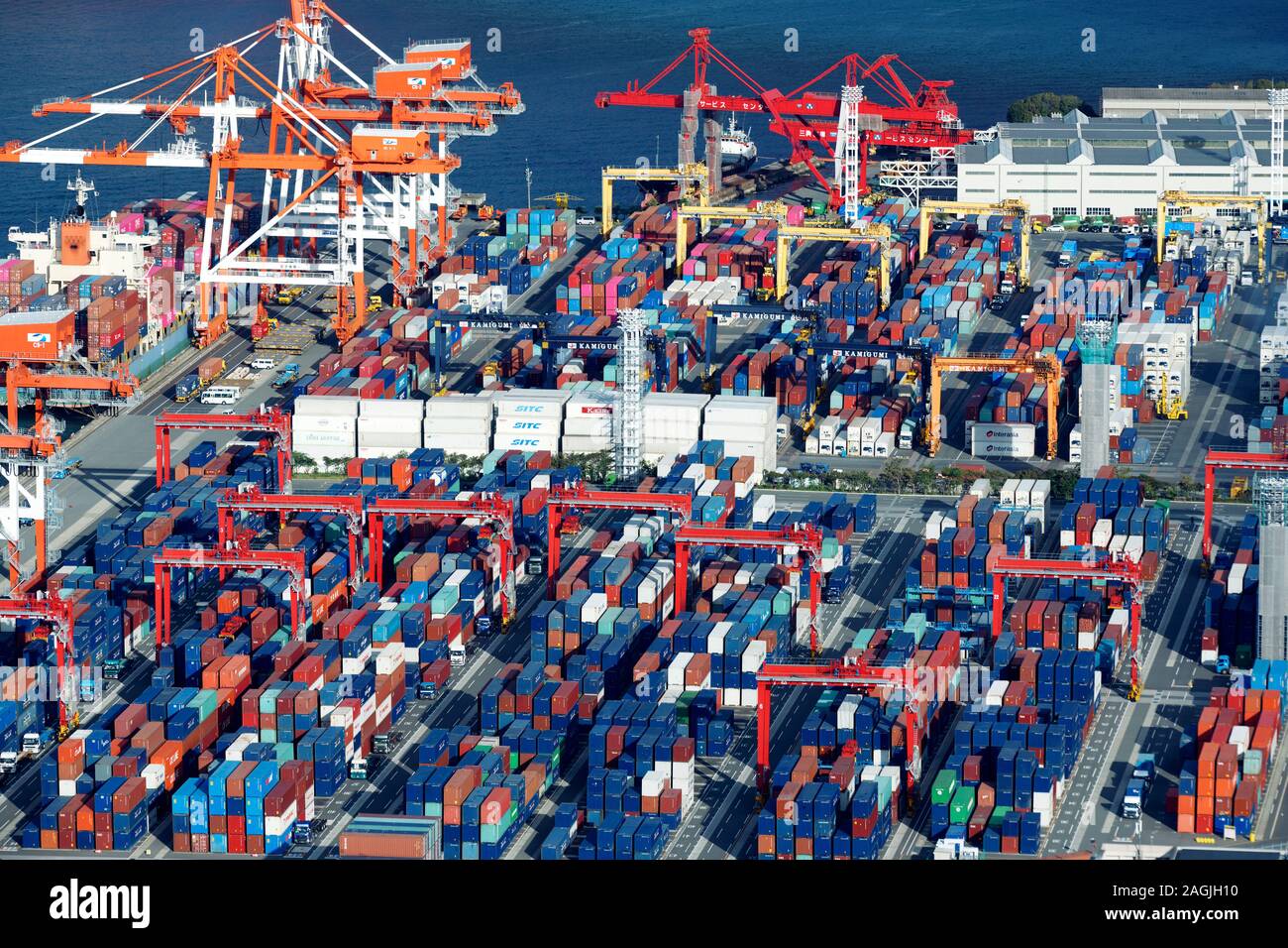 Osaka sea port at Osaka Bay, aerial view of cranes and