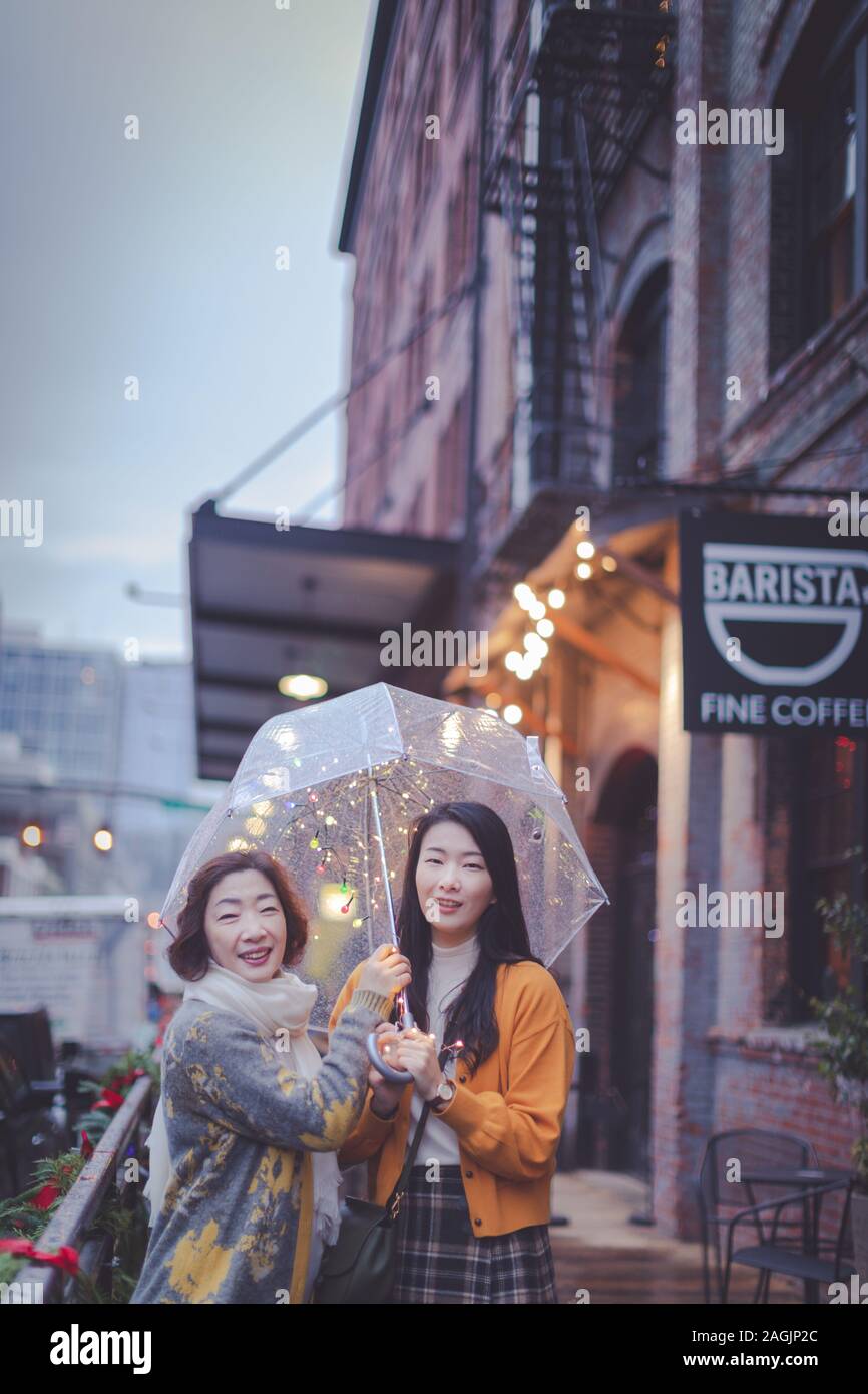 Portland, Oregon Dec 15, 2019 Happy asian elderly mother and adult