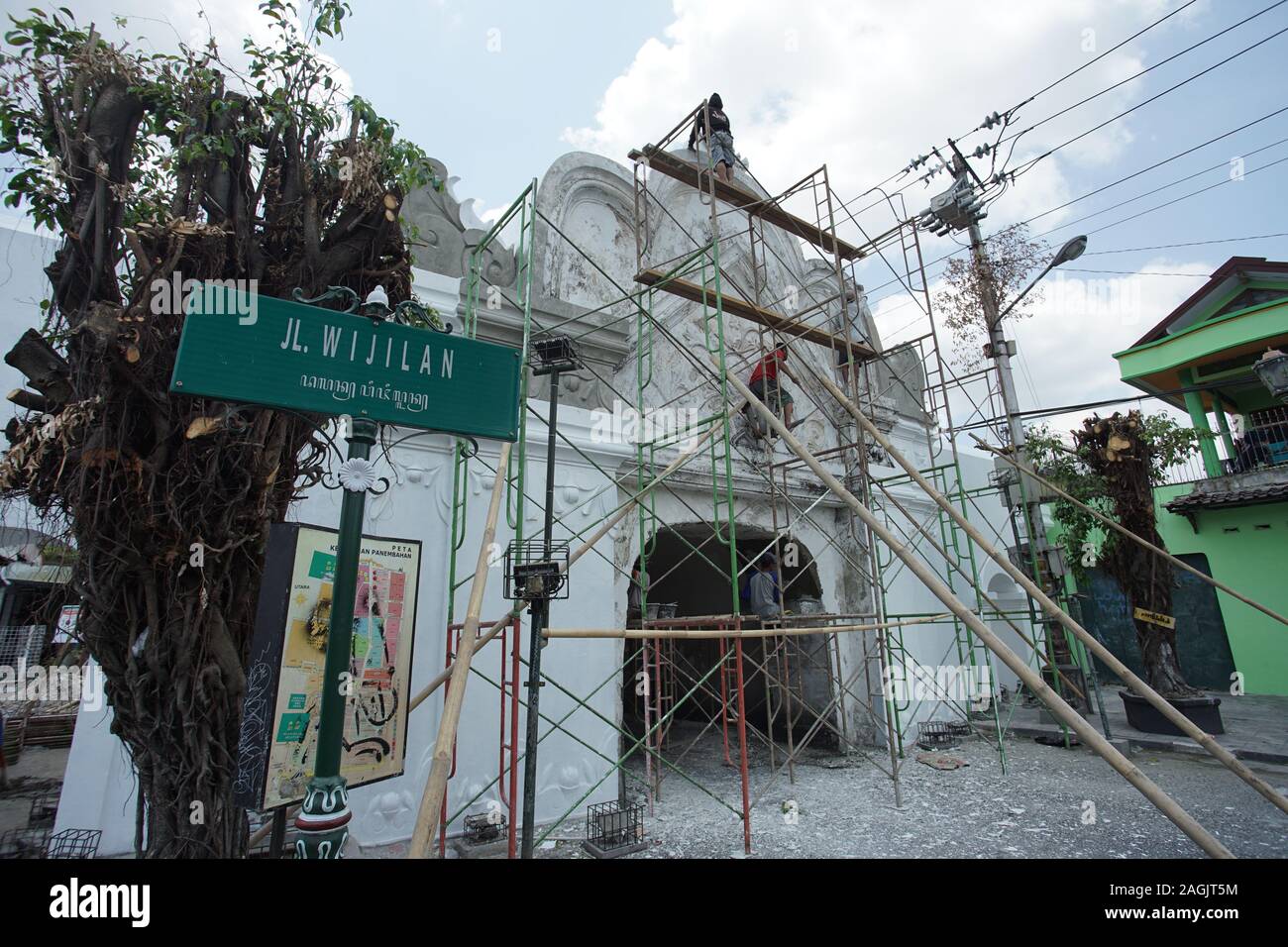 Workers revitalizing one of historical building in Yogyakarta, Plengkung Wijilian Stock Photo