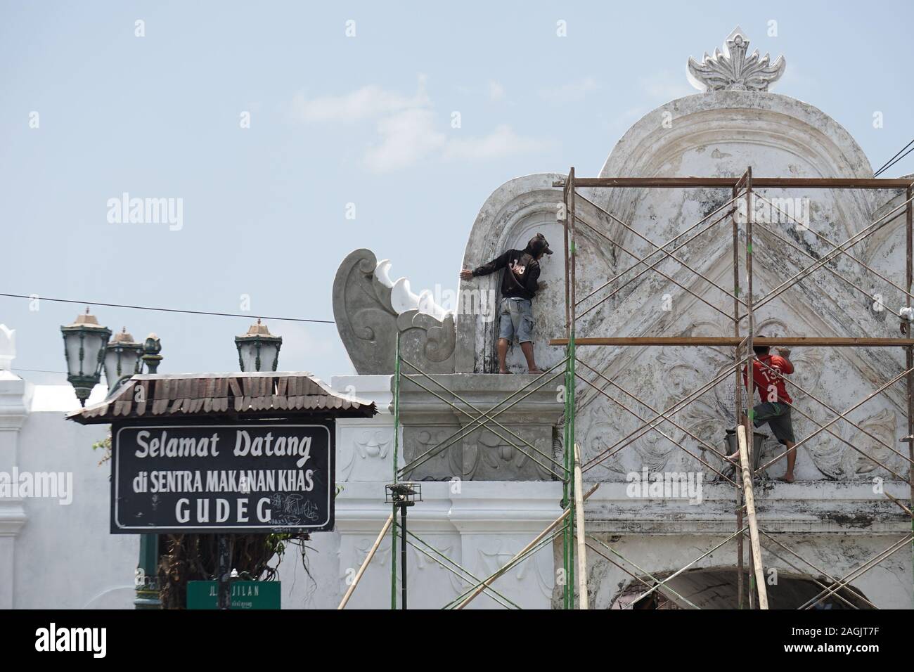 Workers revitalizing one of historical building in Yogyakarta, Plengkung Wijilian Stock Photo