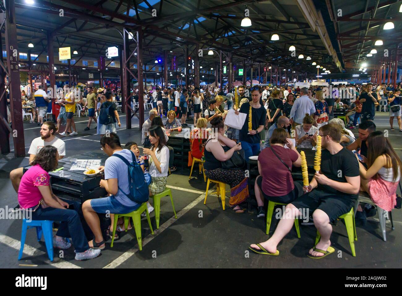 People enjoying food and drink in Queen Victoria Night Market for