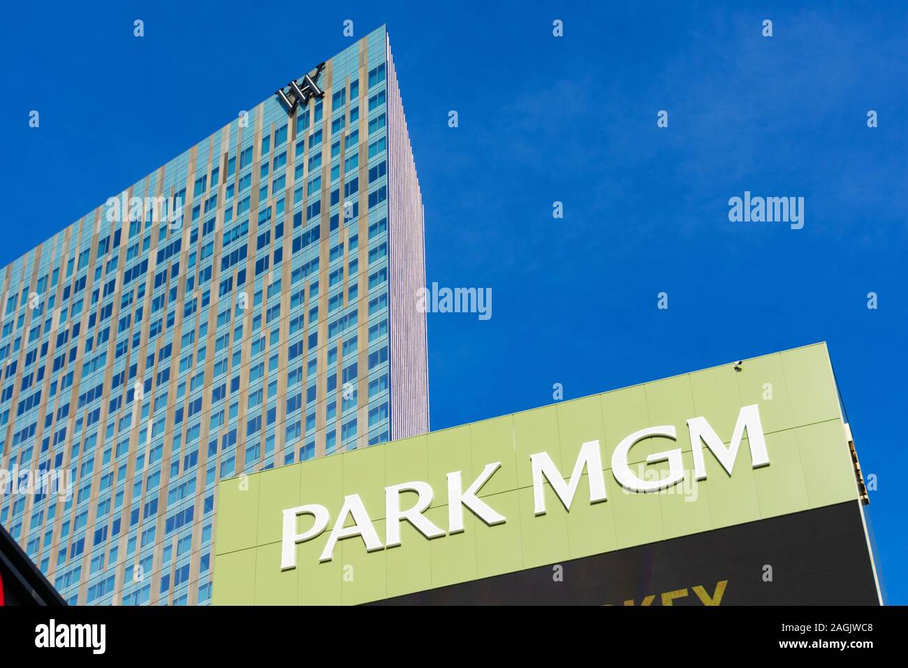 Park MGM resort, hotel and casino sign. Background Waldorf Astoria luxury hotel facade - Las Vegas, Nevada, USA - December, 2019 Stock Photo