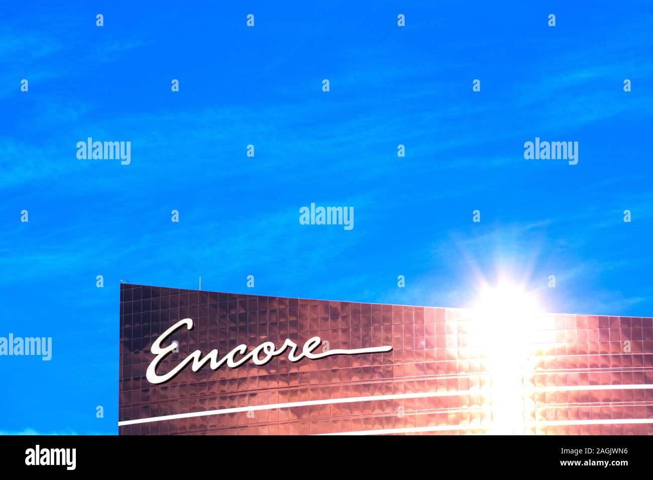 Bright sunlight reflects in the modern facade of Encore luxury hotel and casino as seen from Las Vegas Strip - Las Vegas, Nevada, USA - December, 2019 Stock Photo