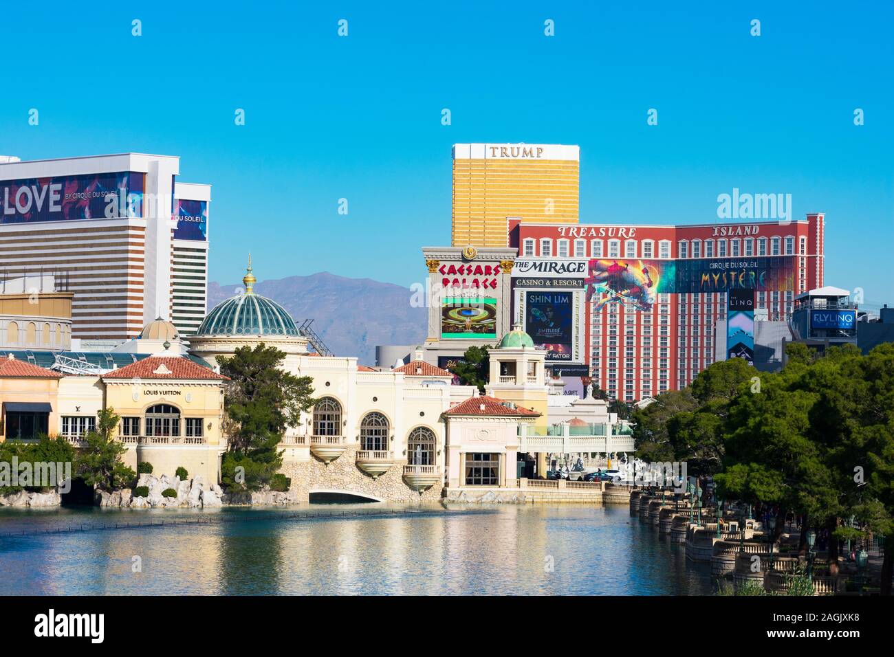 View of Fountains of Bellagio lake surrounded by modern hotels, resorts and casinos - Las Vegas, Nevada, USA - December, 2019 Stock Photo