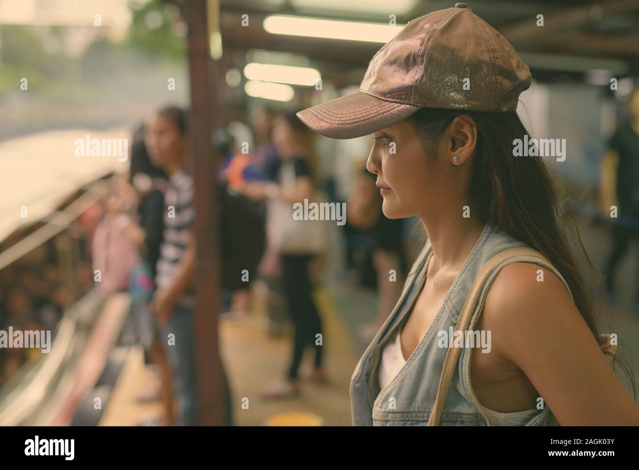 Young beautiful Asian tourist woman exploring the city of Bangkok, Thailand Stock Photo