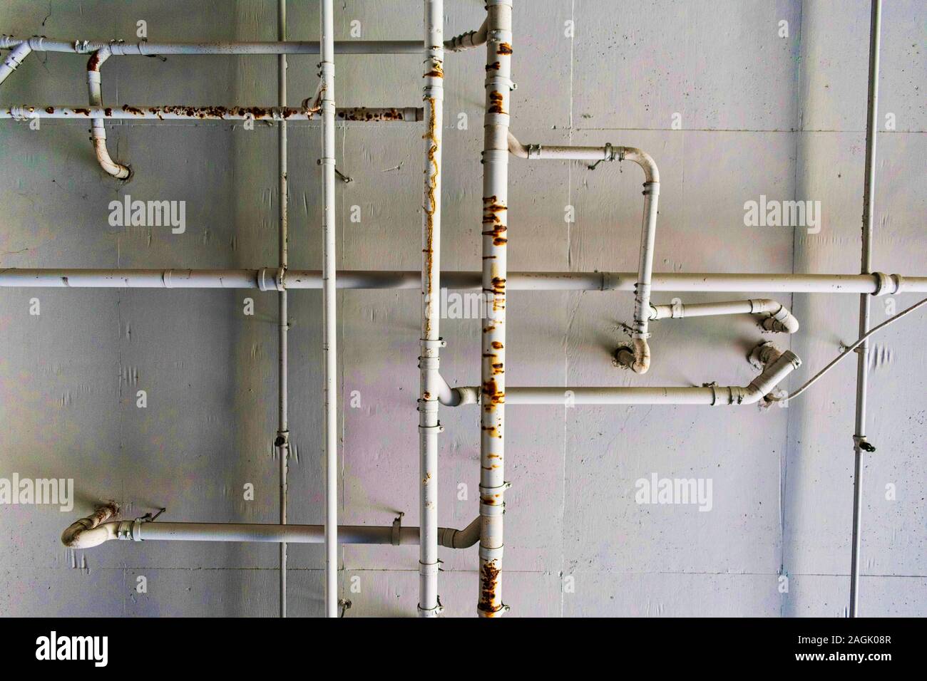 Metal Plumbing System And Water Pipes On Cement Ceiling
