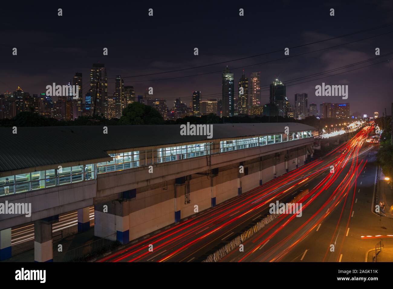 Manila, Philippines - September 1, 2017: Night landscape of EDSA road and Makati, panorama Stock Photo